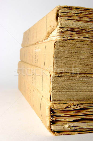 Antique books piled front a silver background Stock photo © Photooiasson