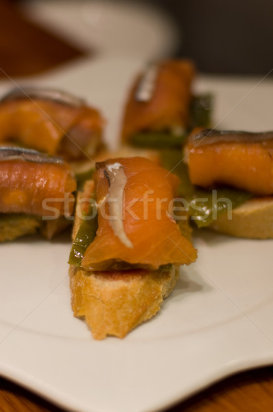Typical Pintxo (Salmon and Cantabrian Anchovy) from San Sebastian. Guipuzcoa, Spain Stock photo © Photooiasson
