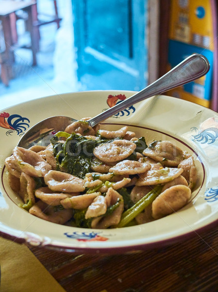 Orecchiette of Puglia with wild rocket salad. Stock photo © Photooiasson