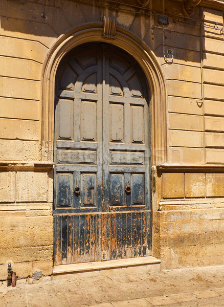 Blue wooden door of a historic building in a downtown of a european street. Stock photo © Photooiasson