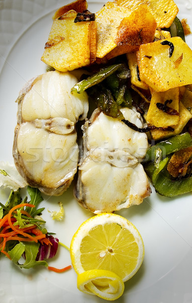 Grilled Hake with potatoes and green peppers. Stock photo © Photooiasson