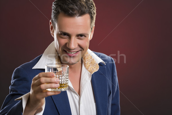 Cheerful businessman toasting Stock photo © photosebia