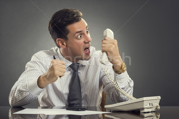 Furious businessman shouting on phone Stock photo © photosebia