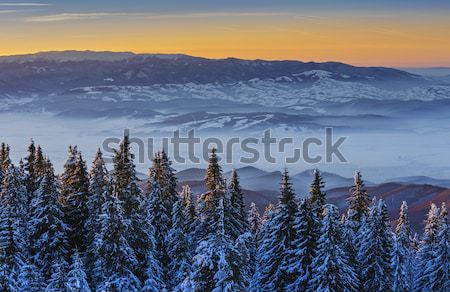 Stock photo: Winter sunset over mountains
