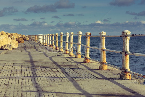 Weathered railings and seafront promenade Stock photo © photosebia