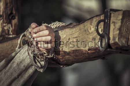 Stock photo: Nailed hand on wooden cross