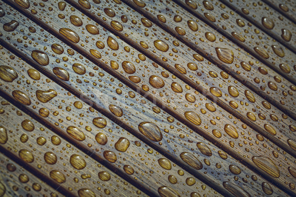 Regendruppels hout waterdruppels patroon houten bank Stockfoto © photosebia