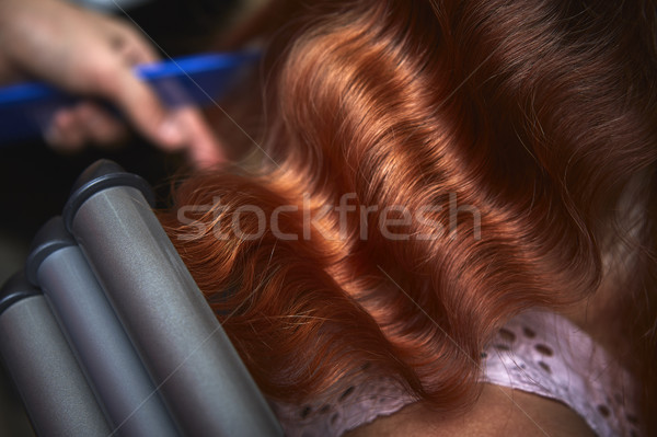 Hair styling with triple barrel curling iron Stock photo © photosebia