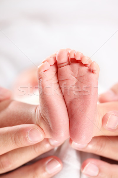 Bebek ayaklar ebeveyn eller Stok fotoğraf © photosoup