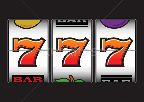 Stock photo: Winner triple sevens at slot machine