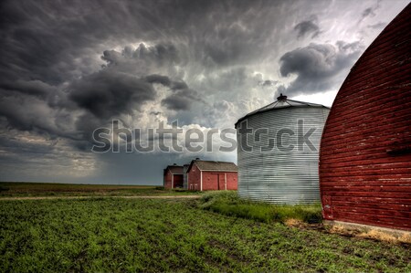 Wooden granary with Cumuloninumbus clouds in background Stock photo © pictureguy