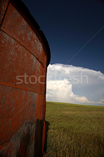 Wooden granary with Cumuloninumbus clouds in background Stock photo © pictureguy