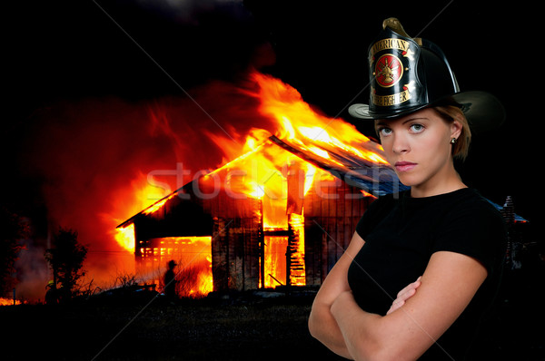 Pompier belle jeune femme feu maison sexy Photo stock © piedmontphoto
