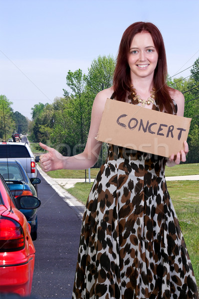 Woman Hitch Hiking to a Concert Stock photo © piedmontphoto