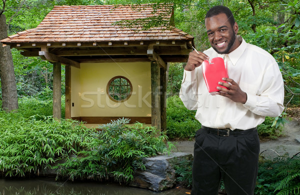 Férfi eszik ázsiai konyha fekete afroamerikai kínai Stock fotó © piedmontphoto