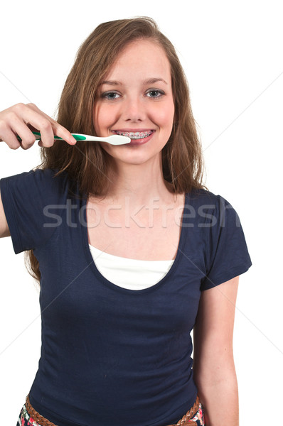 Beautiful Teenage Woman Brushing Teeth Stock photo © piedmontphoto