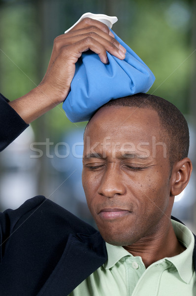 Adam baş ağrısı yakışıklı buz paketlemek Stok fotoğraf © piedmontphoto