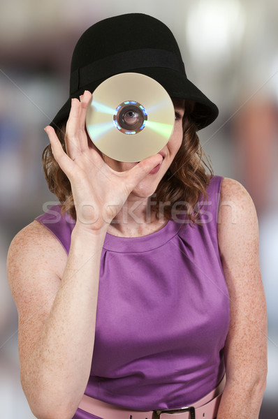 Woman holding CD or DVD Stock photo © piedmontphoto
