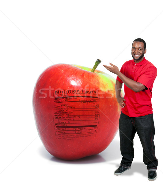 Człowiek jabłko odżywianie etykiety przystojny młody człowiek Zdjęcia stock © piedmontphoto
