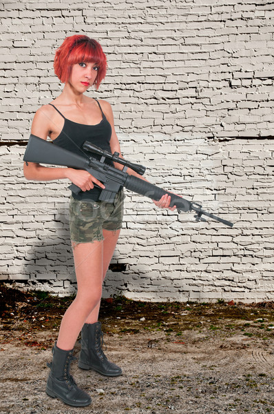 Stock photo: Woman with Assault Rifle