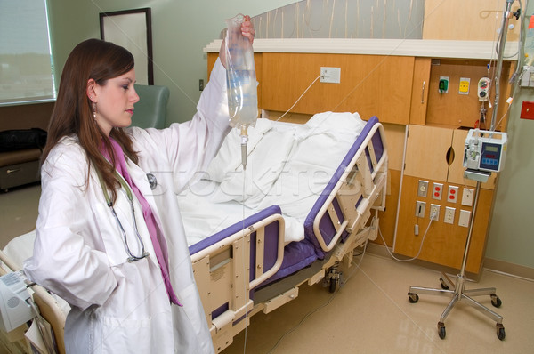 Stock photo: Doctor Holding an IV Bag
