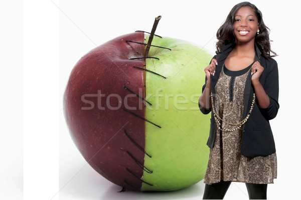 Black teenage girl and a Stitched Apple Stock photo © piedmontphoto