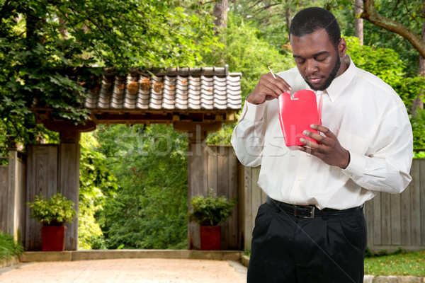 Man Eating Asian Food Stock photo © piedmontphoto