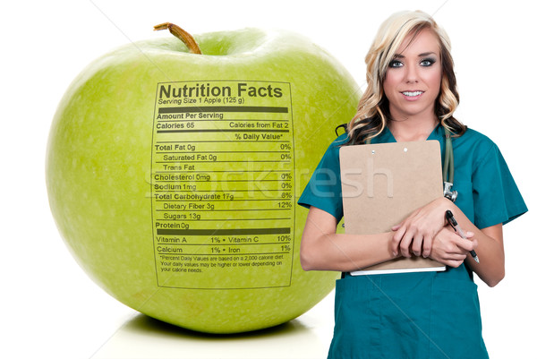 Femenino cardiólogo delicioso manzana roja médico Foto stock © piedmontphoto