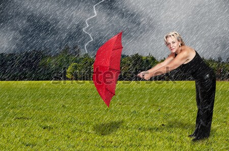 Stock photo: Woman Holding Umbrella