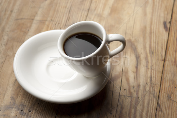 Tilted coffee cup. Stock photo © Pietus