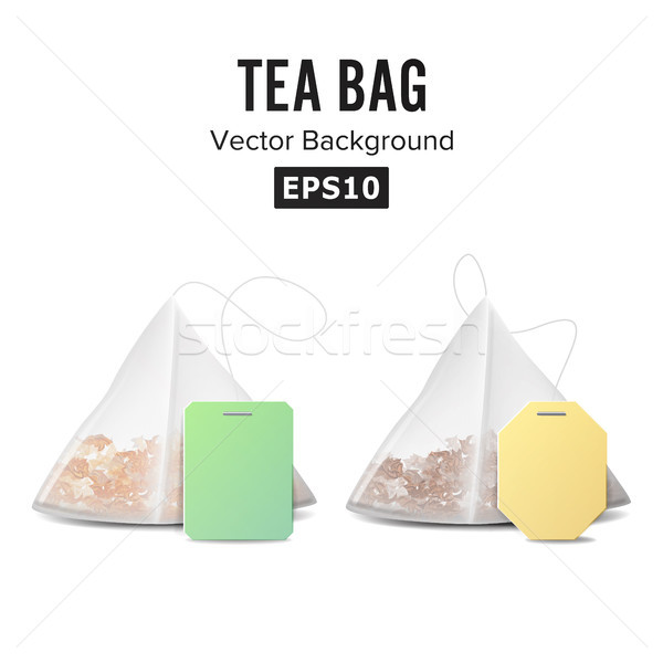 Stock photo: Pyramid Shape Tea Bag Set. Mock Up With Empty Yellow And Green Label. Isolated On White Background. 