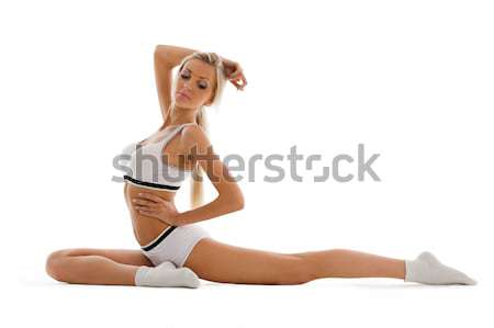 Stock photo: Beautiful blonde is making exercises