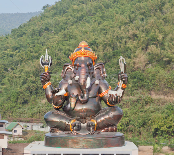 Giant Hindu God Ganesh on top of the building in a temple in Tha Stock photo © pinkblue