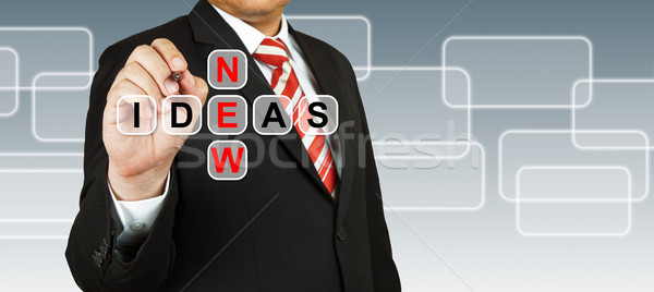 Stock photo: Businessman hand drawing New Ideas