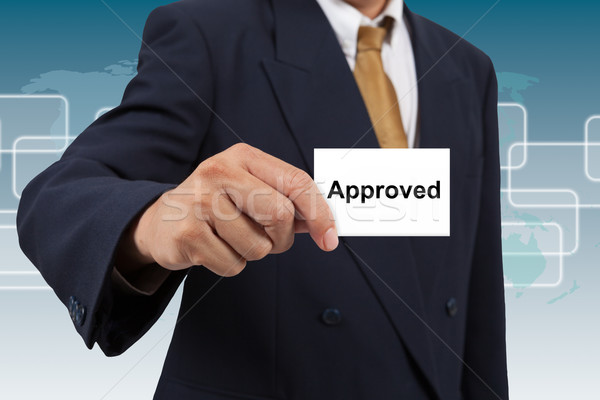 Businessman show a white card with word Approved Stock photo © pinkblue