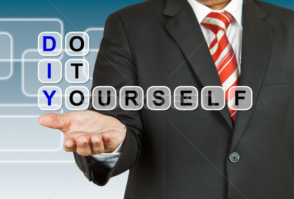 Stock photo: Businessman with wording Do It Yourself