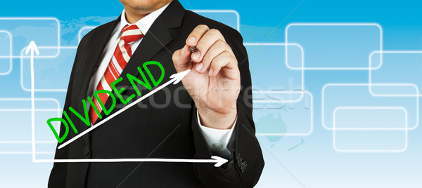 Male hand drawing a graph with Dividend going up Stock photo © pinkblue