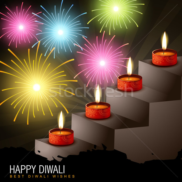 Stock photo: diwali diya with fireworks
