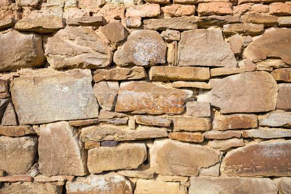 Rustic wall with layers of different shapes of rough sandstones Stock photo © pixachi