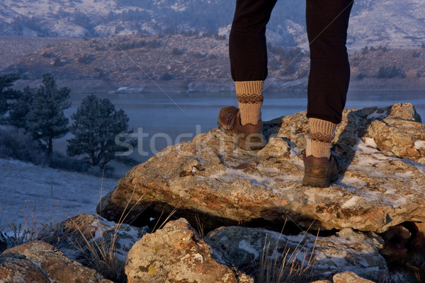 Stock photo: hiker or trail runner legs on rock in sunrise light