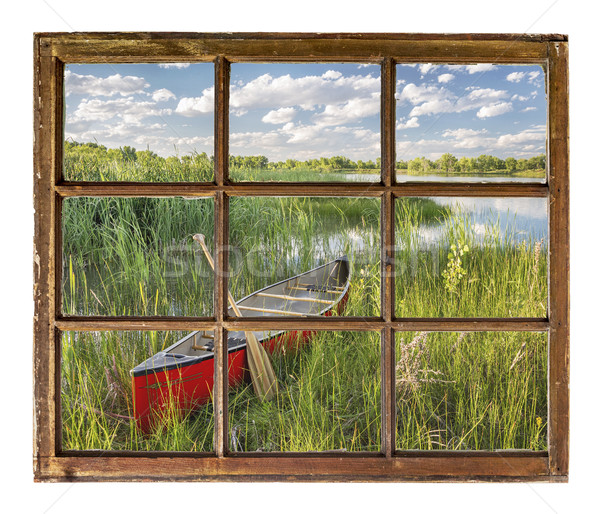 canoe on lake shore - window view Stock photo © PixelsAway