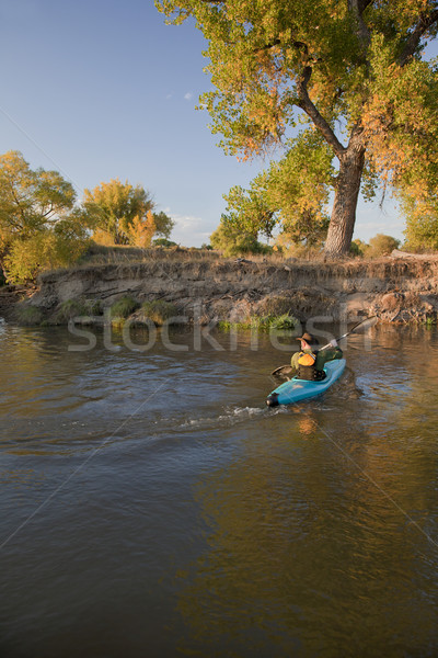 kayaker paddling across a river Stock photo © PixelsAway
