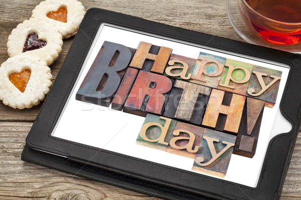 Happy birthday on digital tablet Stock photo © PixelsAway