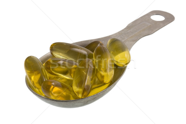 Foto d'archivio: Olio · di · pesce · capsule · giallo · isolato · bianco
