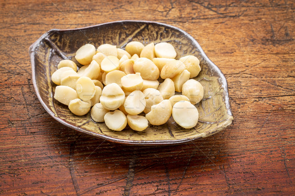 macadamia nuts on leaf bowl Stock photo © PixelsAway