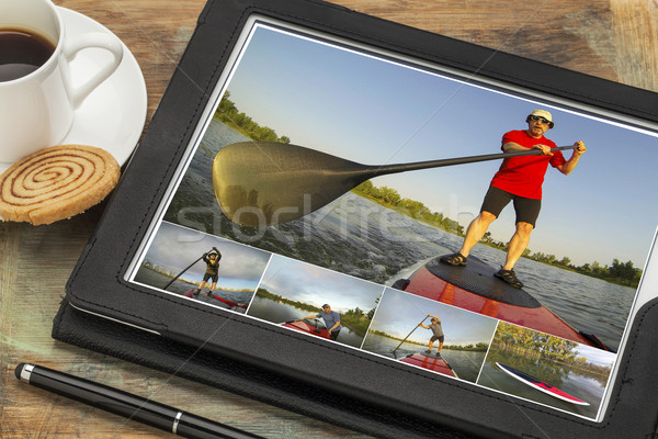 stand up paddling on digital tablet Stock photo © PixelsAway