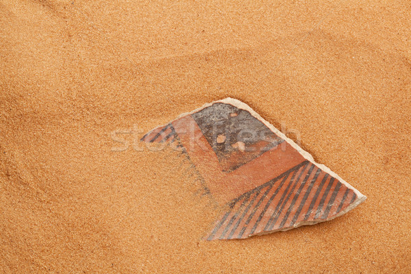 Anasazi pottery shard in red sand Stock photo © PixelsAway