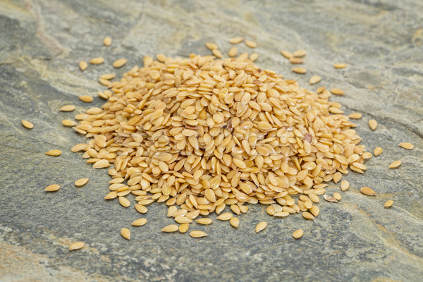 heap of gold flax seeds Stock photo © PixelsAway