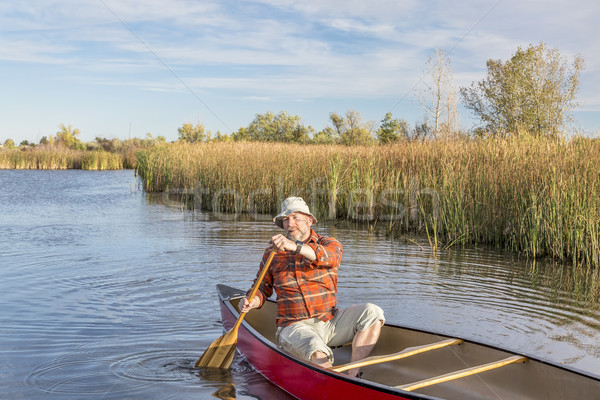 canoeing on a lake Stock photo © PixelsAway