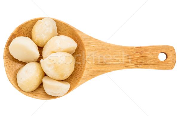 macadamia nuts on wooden spoob Stock photo © PixelsAway